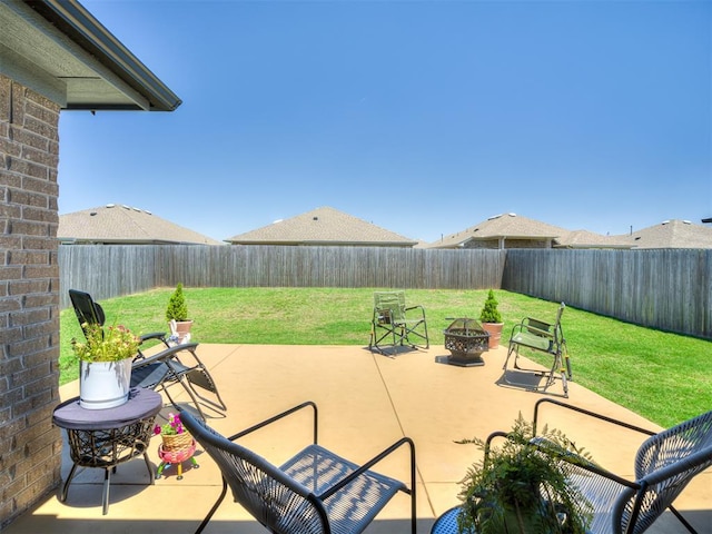 13325 SW 5th St, Yukon, OK 73099 - view of patio with an outdoor fire pit
