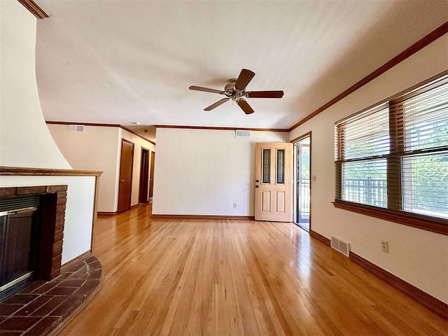 1312 N Carol Ln, Oklahoma City, OK 73127 - unfurnished living room with ceiling fan, light wood-style flooring, ornamental molding, a fireplace, and baseboards