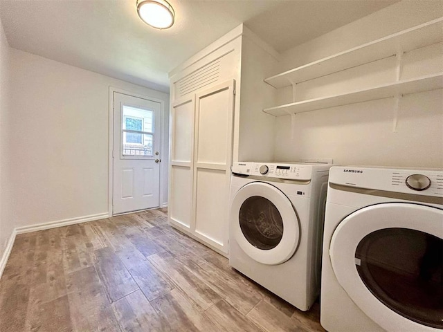 1312 N Carol Ln, Oklahoma City, OK 73127 - laundry area with washer and clothes dryer, light wood-style flooring, and baseboards