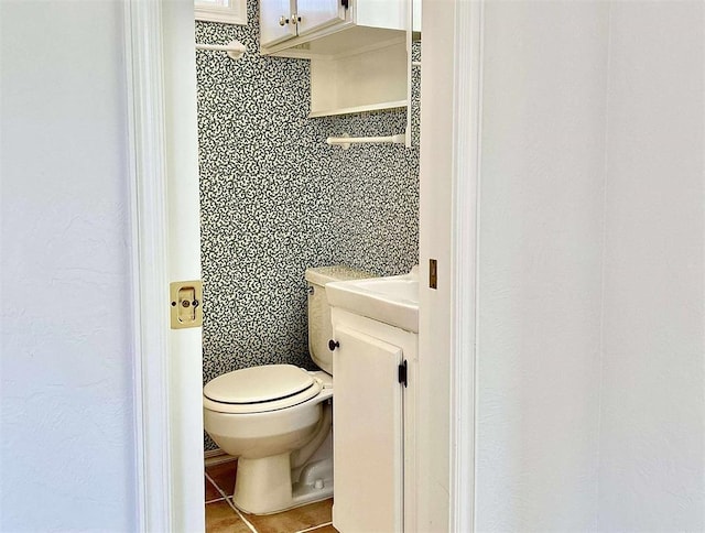 1312 N Carol Ln, Oklahoma City, OK 73127 - half bath with toilet, tile patterned flooring, and vanity