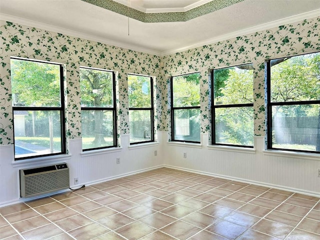 1312 N Carol Ln, Oklahoma City, OK 73127 - unfurnished room with crown molding, a wall mounted air conditioner, plenty of natural light, light tile patterned floors, and wallpapered walls