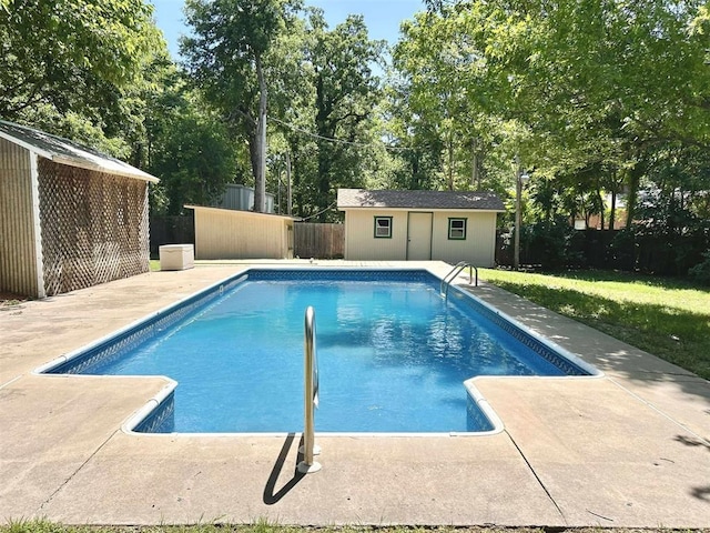 1312 N Carol Ln, Oklahoma City, OK 73127 - view of pool featuring an outbuilding, a storage structure, a patio area, and a fenced backyard