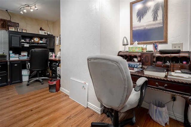 1889 Cobblestone Rd, Sulphur, OK 73086 - office area with light wood-style flooring and a textured wall