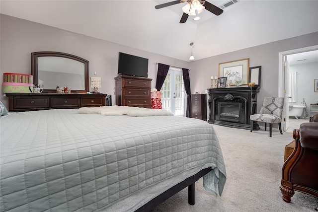 1889 Cobblestone Rd, Sulphur, OK 73086 - bedroom featuring carpet flooring, vaulted ceiling, a glass covered fireplace, a ceiling fan, and access to outside
