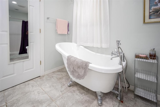 1889 Cobblestone Rd, Sulphur, OK 73086 - bathroom featuring a freestanding bath and baseboards