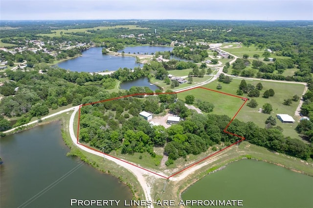 1889 Cobblestone Rd, Sulphur, OK 73086 - aerial view of property's location featuring property boundaries highlighted, a nearby body of water, and a heavily wooded area