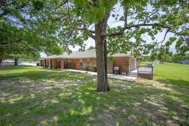 1889 Cobblestone Rd, Sulphur, OK 73086 - view of grassy yard with a deck