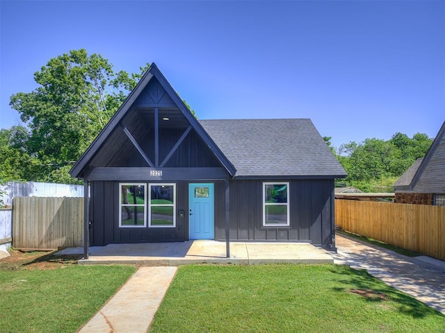 2025 NW 30th St, Oklahoma City, OK 73118 - view of front of property featuring board and batten siding and roof with shingles