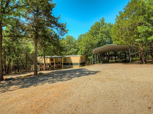 332 Royal Ln, Canadian, OK 74425 - view of yard with driveway and a detached carport
