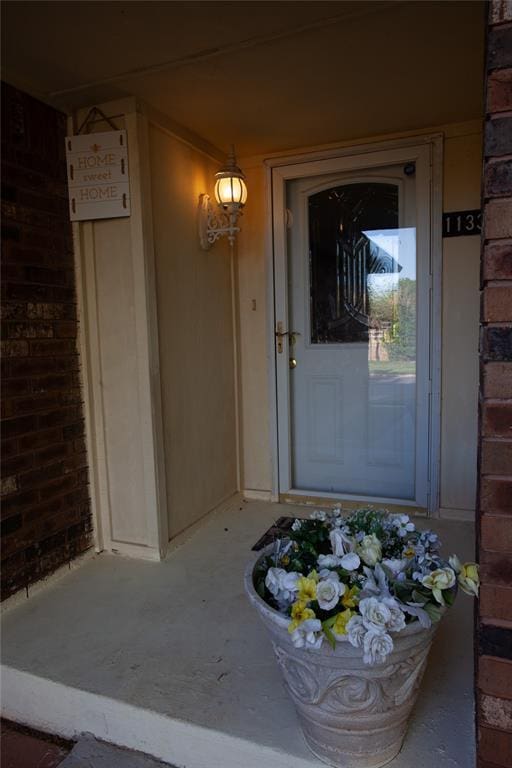 11332 Cimarron Dr, Oklahoma City, OK 73162 - property entrance featuring brick siding