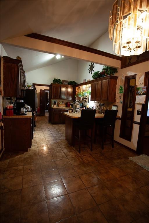 11332 Cimarron Dr, Oklahoma City, OK 73162 - dining area featuring vaulted ceiling