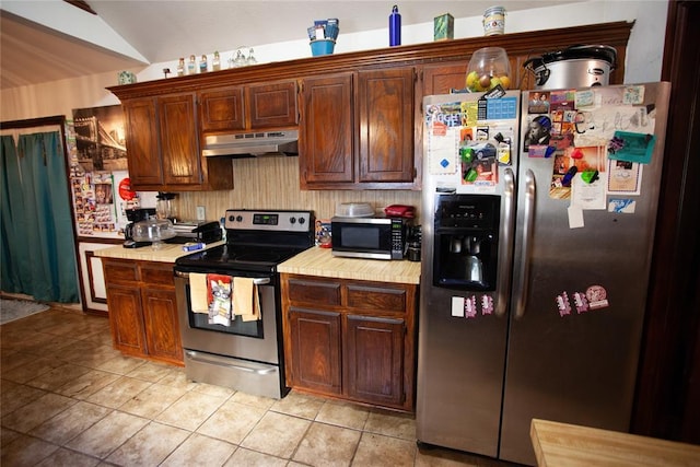 11332 Cimarron Dr, Oklahoma City, OK 73162 - kitchen with appliances with stainless steel finishes, under cabinet range hood, light countertops, and light tile patterned flooring