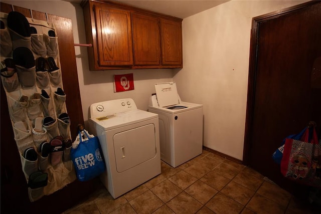 11332 Cimarron Dr, Oklahoma City, OK 73162 - washroom featuring separate washer and dryer, cabinet space, baseboards, and tile patterned flooring