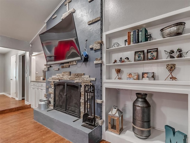 12601 Rock Springs Rd, Jones, OK 73049 - living area featuring wood finished floors and a fireplace
