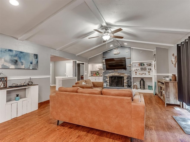 12601 Rock Springs Rd, Jones, OK 73049 - living area with a fireplace, wood finished floors, and ceiling fan