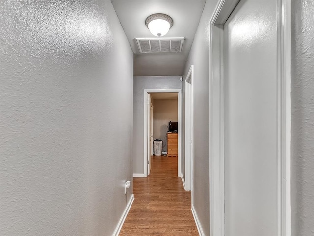 12601 Rock Springs Rd, Jones, OK 73049 - corridor featuring wood finished floors and baseboards