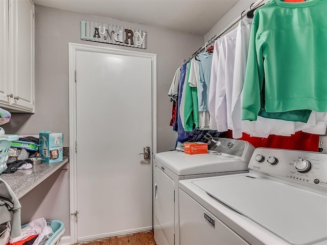 12601 Rock Springs Rd, Jones, OK 73049 - laundry room with washer and dryer, cabinet space, and wood finished floors