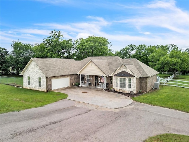 20486 Cypress Way, Tecumseh, OK 74873 - single story home with stone siding, concrete driveway, an attached garage, cooling unit, and a shingled roof