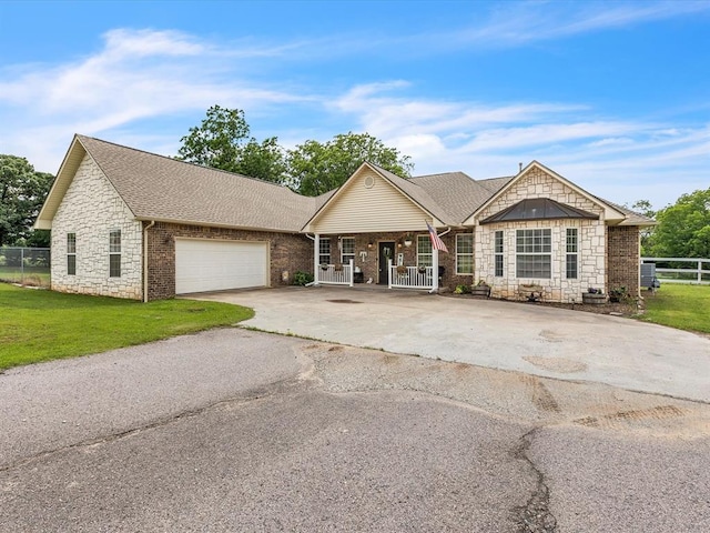 20486 Cypress Way, Tecumseh, OK 74873 - view of front of house with asphalt driveway, covered porch, stone siding, a garage, and a shingled roof