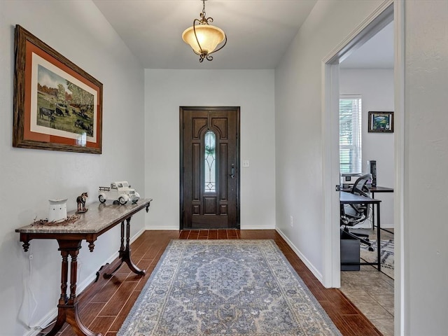20486 Cypress Way, Tecumseh, OK 74873 - entryway featuring dark wood finished floors and baseboards