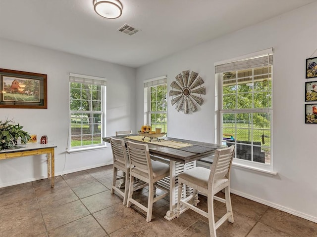 20486 Cypress Way, Tecumseh, OK 74873 - dining room featuring baseboards and tile patterned flooring