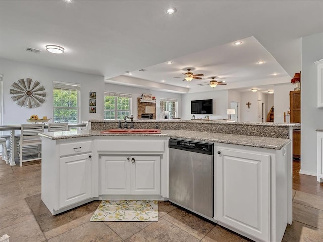 20486 Cypress Way, Tecumseh, OK 74873 - kitchen featuring dishwasher, a sink, a tray ceiling, ceiling fan, and recessed lighting