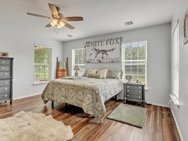 20486 Cypress Way, Tecumseh, OK 74873 - bedroom with wood finished floors, baseboards, and a ceiling fan