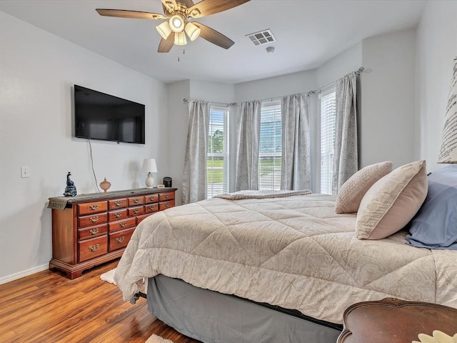 20486 Cypress Way, Tecumseh, OK 74873 - bedroom featuring wood finished floors, baseboards, and a ceiling fan