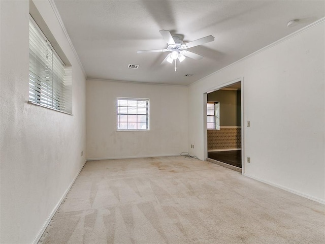 4308 NW 60th Pl, Oklahoma City, OK 73112 - carpeted spare room featuring a ceiling fan, a smoke detector, crown molding, and healthy amount of natural light