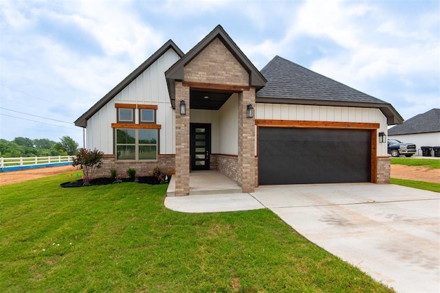1001 Heritage Hills Dr, Tuttle, OK 73089 - view of front of property with a garage, roof with shingles, board and batten siding, driveway, and brick siding