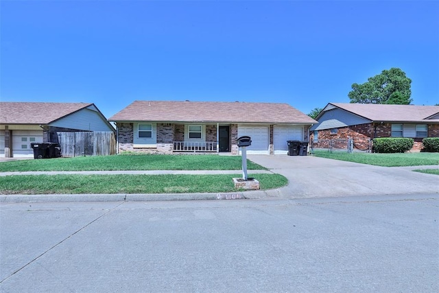 1101 S English St, Moore, OK 73160 - ranch-style home with an attached garage, a porch, and concrete driveway