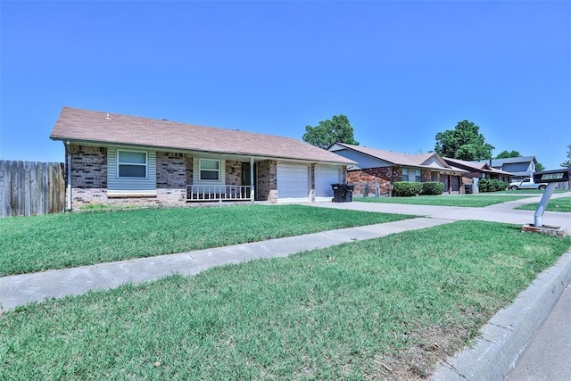 1101 S English St, Moore, OK 73160 - ranch-style house with brick siding, a porch, a garage, and driveway