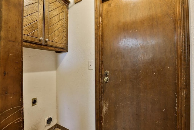 1101 S English St, Moore, OK 73160 - laundry room featuring hookup for an electric dryer and cabinet space