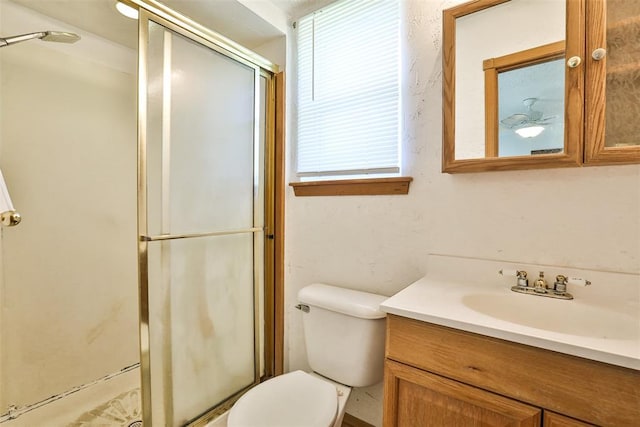 1101 S English St, Moore, OK 73160 - full bathroom with vanity, toilet, a shower stall, and plenty of natural light