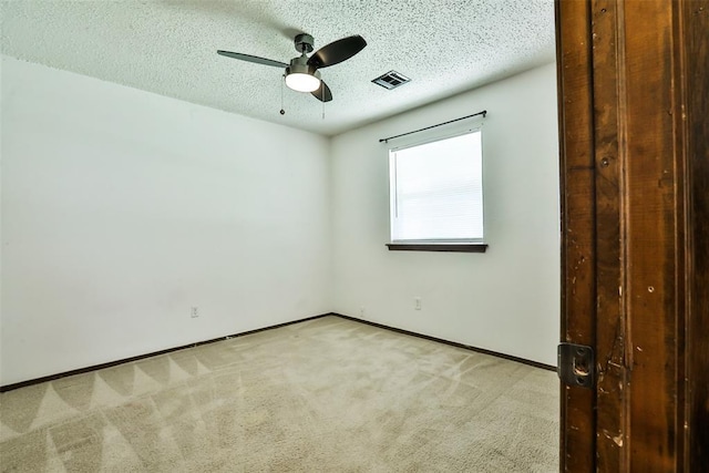 1101 S English St, Moore, OK 73160 - unfurnished room with carpet, a ceiling fan, a textured ceiling, and baseboards