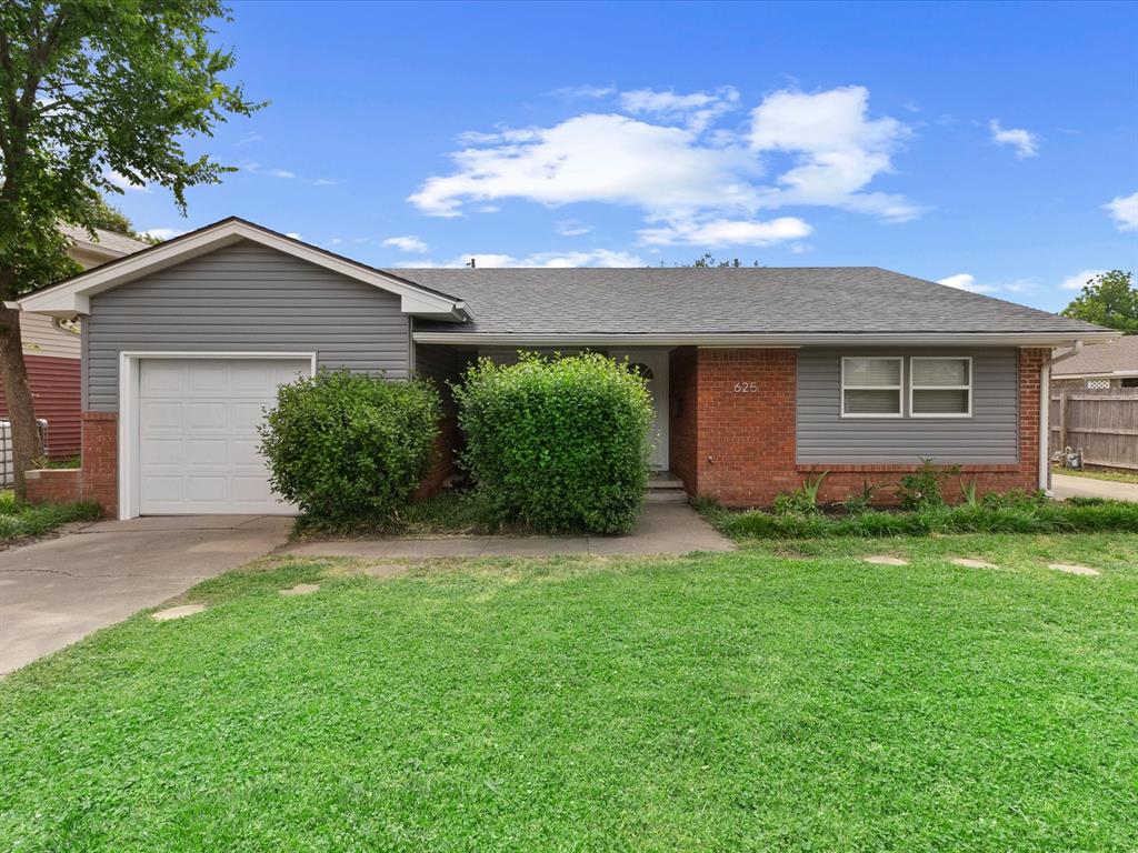 625 Barbour Ave, Norman, OK 73069 - single story home featuring brick siding, driveway, a garage, and roof with shingles