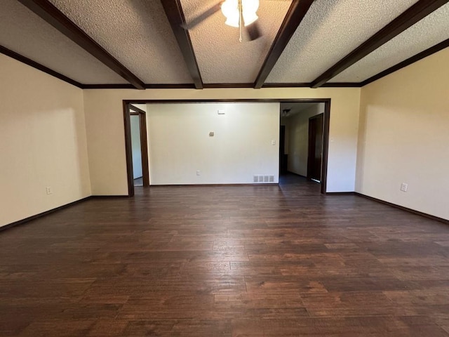 19 Mohican Cir, Shawnee, OK 74801 - spare room with a textured ceiling, beamed ceiling, wood finished floors, and baseboards
