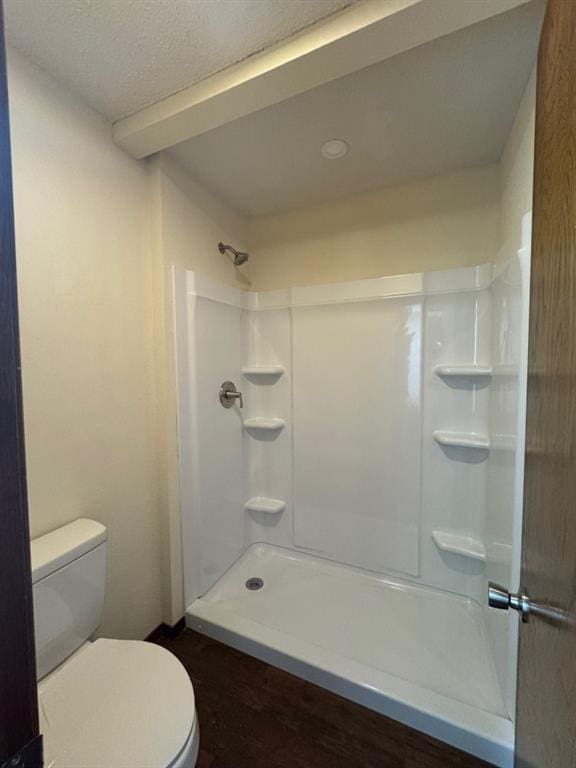 19 Mohican Cir, Shawnee, OK 74801 - full bathroom with toilet, a shower, wood finished floors, and a textured ceiling