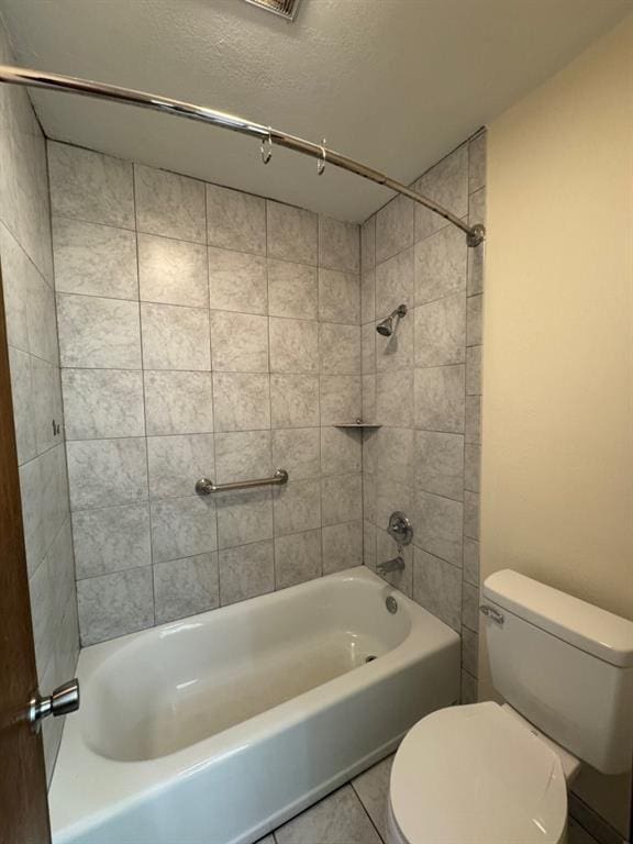 19 Mohican Cir, Shawnee, OK 74801 - full bath featuring toilet, tile patterned flooring,  shower combination, and a textured ceiling