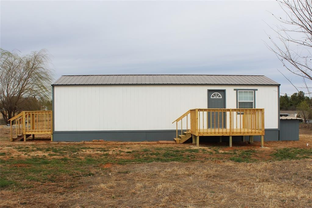333350 Saddle Up Dr, Mcloud, OK 74851 - rear view of property featuring a wooden deck and metal roof