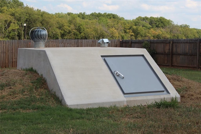 333350 Saddle Up Dr, Mcloud, OK 74851 - entry to storm shelter featuring a fenced backyard