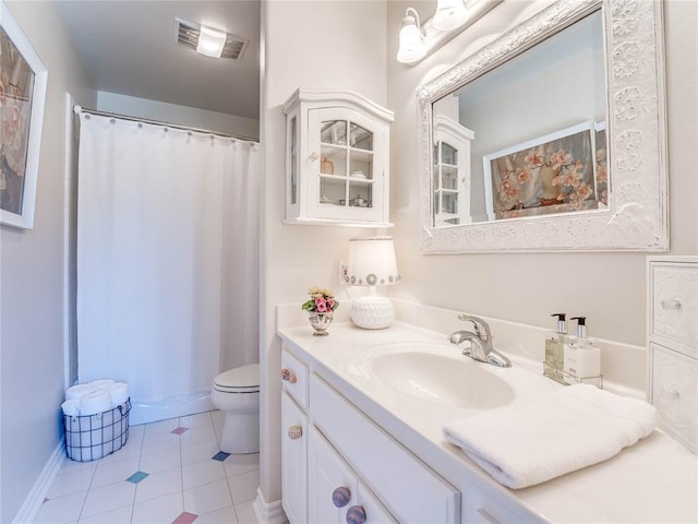512 E Prairie Grove Rd, Guthrie, OK 73044 - bathroom featuring vanity, toilet, tile patterned flooring, and curtained shower