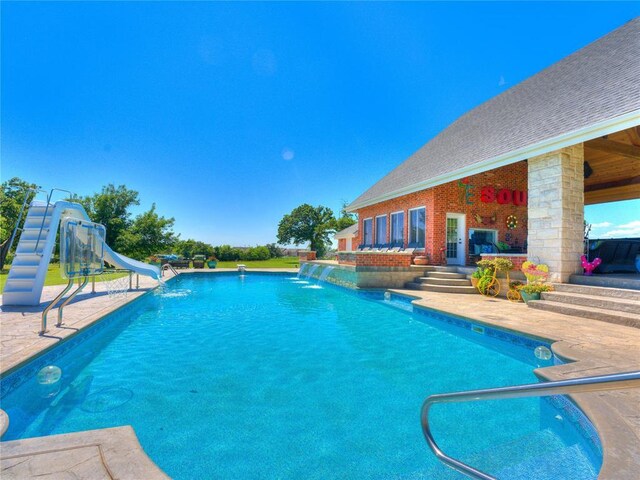 512 E Prairie Grove Rd, Guthrie, OK 73044 - swimming pool featuring a water slide and a patio