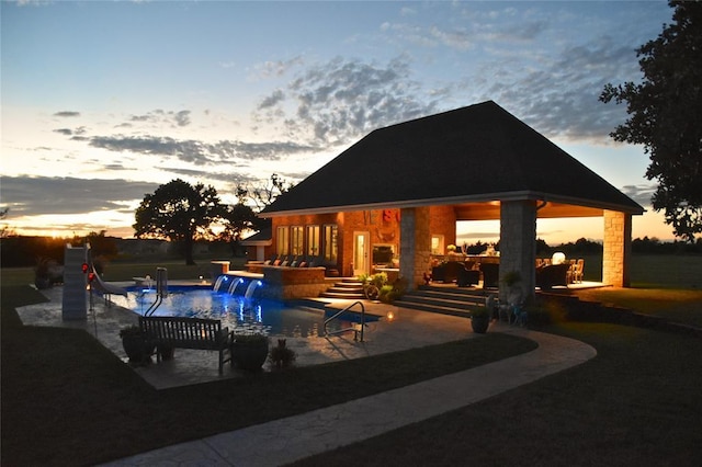 512 E Prairie Grove Rd, Guthrie, OK 73044 - pool at dusk featuring a water slide, a patio area, and a gazebo