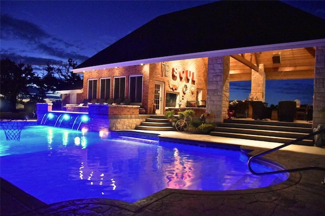 512 E Prairie Grove Rd, Guthrie, OK 73044 - pool at night with an outdoor pool