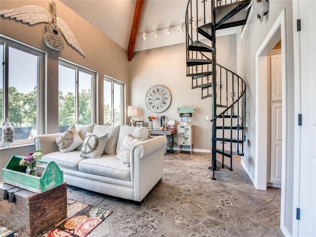 512 E Prairie Grove Rd, Guthrie, OK 73044 - living area with stairs, stone finish flooring, beamed ceiling, high vaulted ceiling, and baseboards