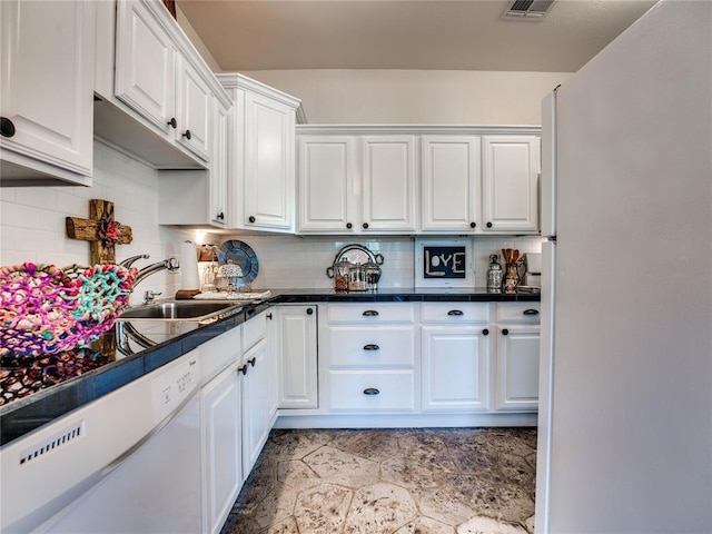 512 E Prairie Grove Rd, Guthrie, OK 73044 - kitchen with white appliances, white cabinetry, a sink, backsplash, and stone finish flooring