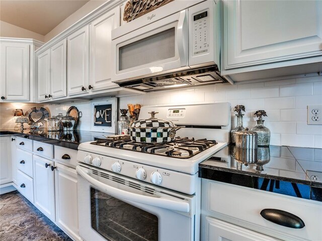 512 E Prairie Grove Rd, Guthrie, OK 73044 - kitchen featuring white appliances, dark countertops, white cabinets, and decorative backsplash