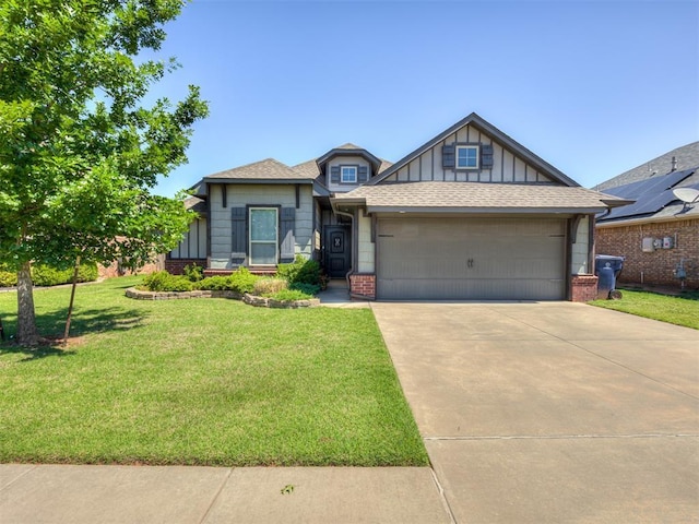 8109 NW 160th Ter, Edmond, OK 73013 - craftsman-style home with brick siding, an attached garage, a front yard, and concrete driveway
