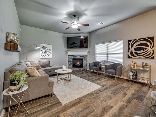 8109 NW 160th Ter, Edmond, OK 73013 - living room with wood finished floors, a fireplace, ceiling fan, and baseboards